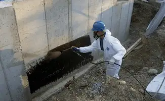 Professional waterproofing the exterior walls of the basement in Hollywood, FL