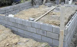 Professionals building a foundation with blocks in Hollywood, FL